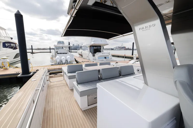 Slide: The Image of 2024 Pardo Yachts 43 luxury yacht docked, featuring spacious deck and modern seating. - 40