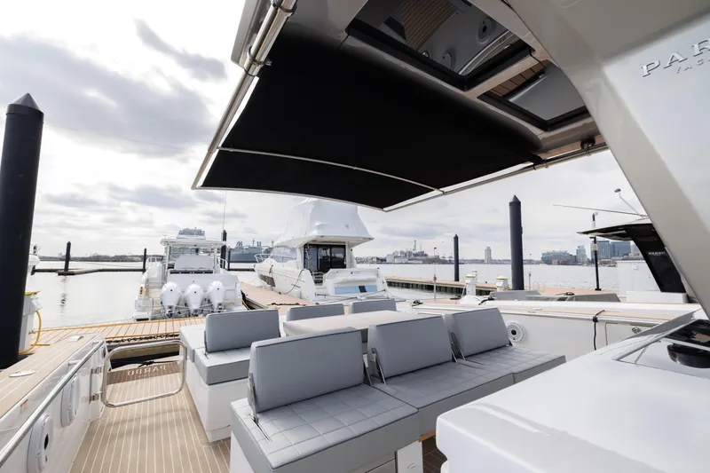 Slide: The Image of 2024 Pardo Yachts 43 at a marina, featuring a spacious deck and seating area. - 41
