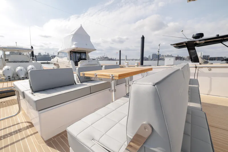 Slide: The Image of 2024 Pardo Yachts 43 deck with modern seating and table. - 14