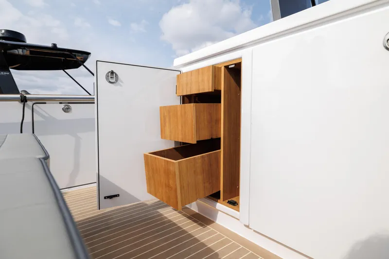 Slide: The Image of Open storage drawers on the deck of a 2024 Pardo Yachts 43. - 19