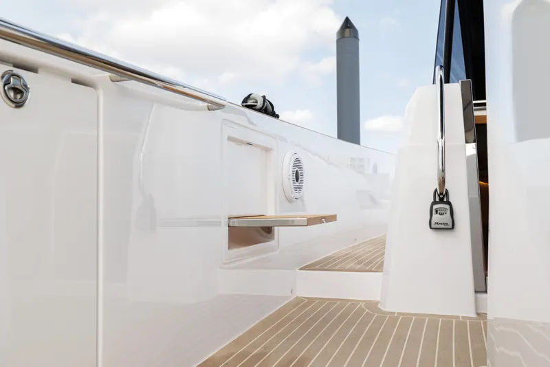 Slide: The Image of 2024 Pardo Yachts 43 deck with sleek white finish and wooden flooring. - 28