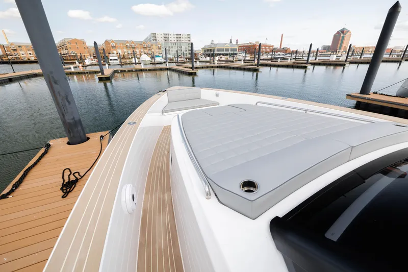 Slide: The Image of 2024 Pardo Yachts 43 docked at a marina, showcasing its sleek deck design. - 29