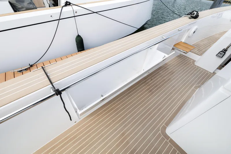 Slide: The Image of 2024 Pardo Yachts 43 deck with open storage compartment and teak flooring. - 35