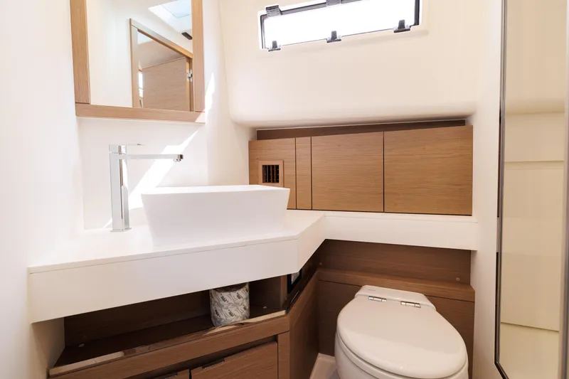 Slide: The Image of Modern bathroom interior of 2024 Pardo Yachts 43 with sleek fixtures and wooden cabinetry. - 48