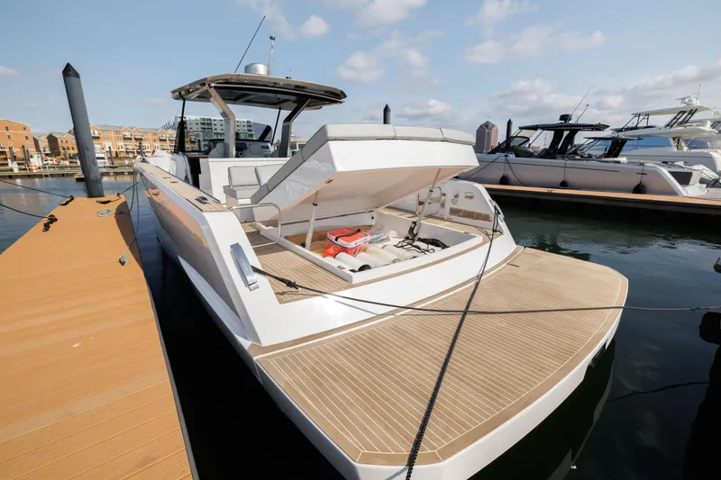 Slide: The Image of 2024 Pardo Yachts 43 docked, showcasing open storage compartment. - 9