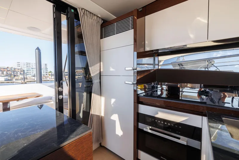 Slide: The Image of Modern kitchen on a 2026 Prestige 520 yacht. - 19