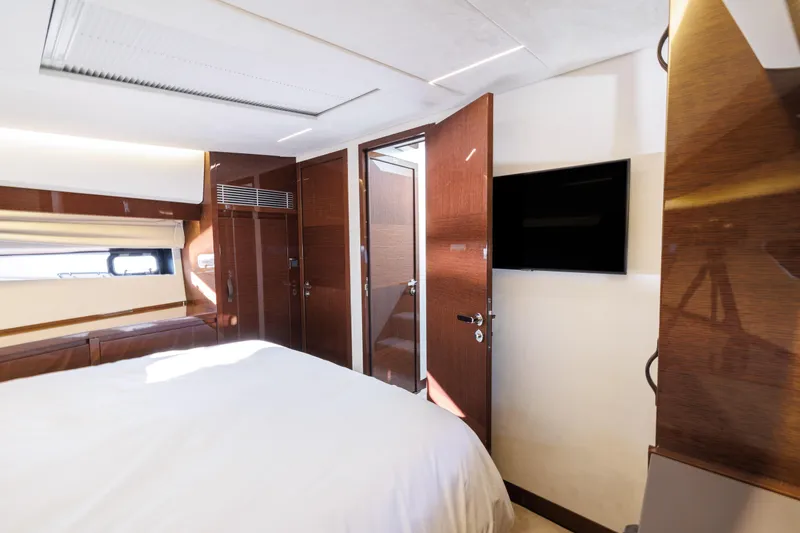 Slide: The Image of Luxurious bedroom in the 2026 Prestige 520 yacht model. - 28