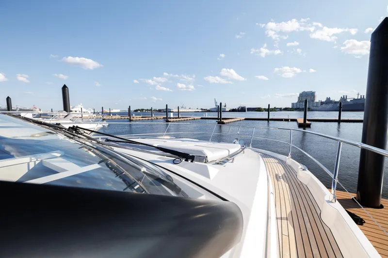 Slide: The Image of Aerial view of a 2026 Prestige 520 yacht on dark water. - 44