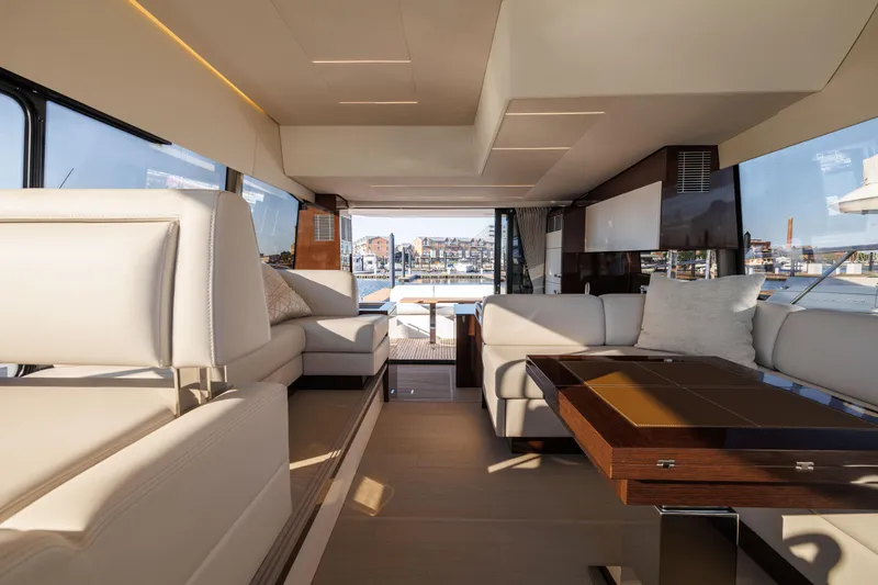 Slide: The Image of Interior of a 2026 Prestige 520 yacht with modern amenities. - 49