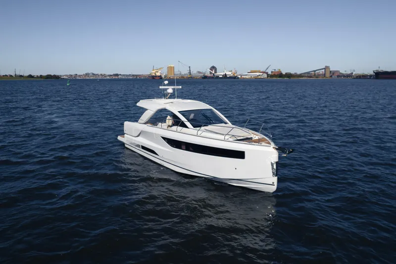 Slide: The Image of 2024 Jeanneau DB|43 Outboard yacht cruising on open water. - 1