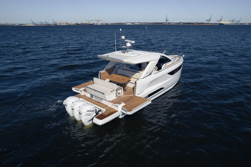 Slide: The Image of 2024 Jeanneau DB|43 Outboard yacht cruising on open water. - 10