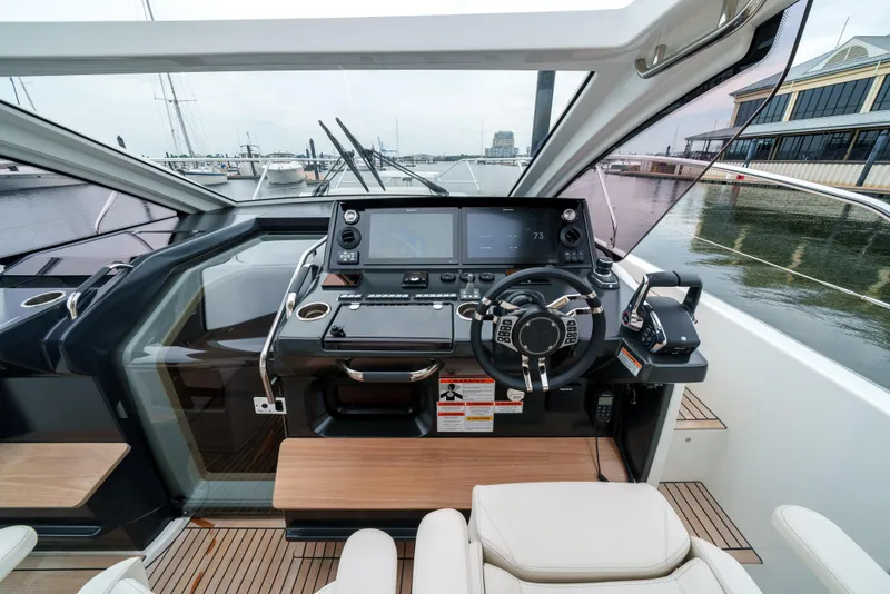 Slide: The Image of 2024 Jeanneau DB|43 Outboard helm with modern controls and navigation screens. - 20