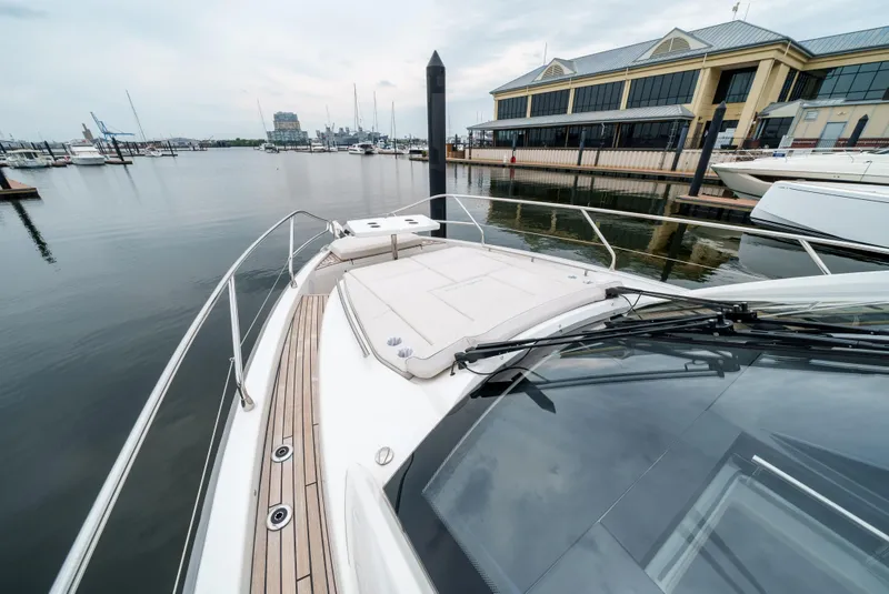Slide: The Image of 2024 Jeanneau DB|43 Outboard yacht docked at marina, showcasing sleek deck design. - 22