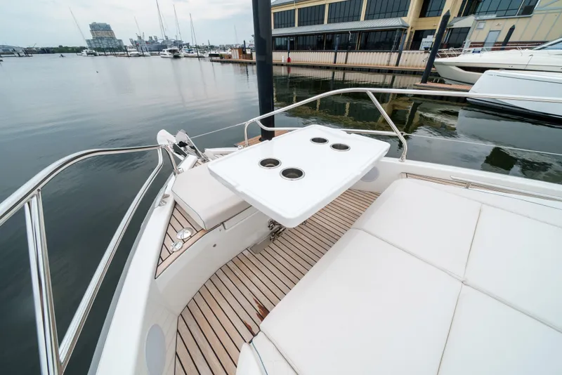 Slide: The Image of 2024 Jeanneau DB|43 Outboard boat with sleek deck and seating area by the marina. - 23