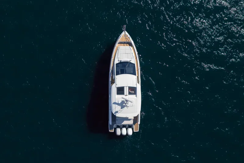 Slide: The Image of 2024 Jeanneau DB|43 Outboard yacht on open water, aerial view. - 4