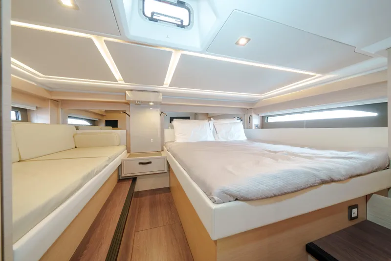 Slide: The Image of Luxurious interior of 2024 Jeanneau DB|43 Outboard with spacious bed and modern lighting. - 41