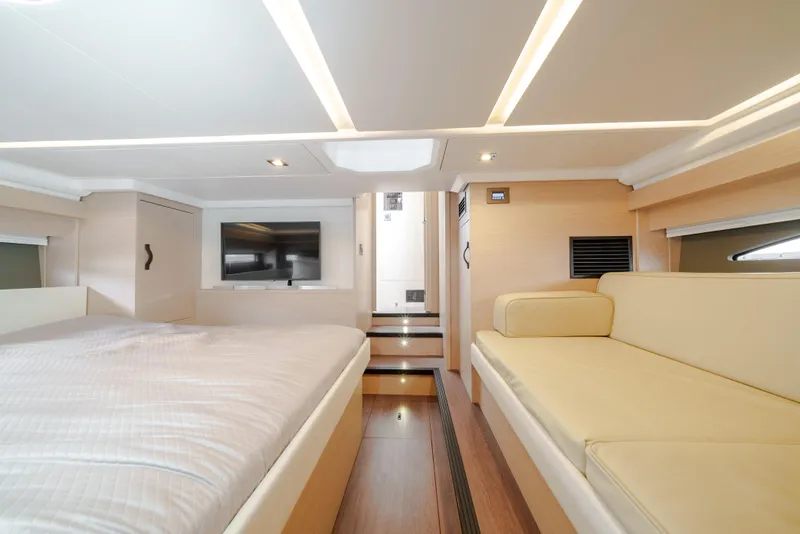 Slide: The Image of Luxurious interior of 2024 Jeanneau DB|43 Outboard with modern furnishings and ambient lighting. - 43