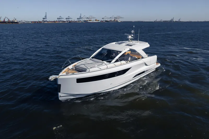 Slide: The Image of 2024 Jeanneau DB|43 Outboard yacht cruising on open water. - 7