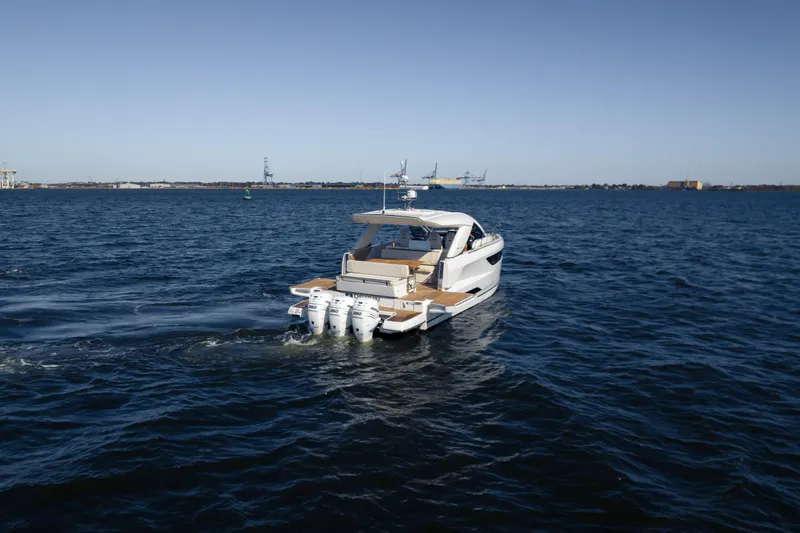 Slide: The Image of 2024 Jeanneau DB|43 Outboard cruising on open water under clear skies. - 8