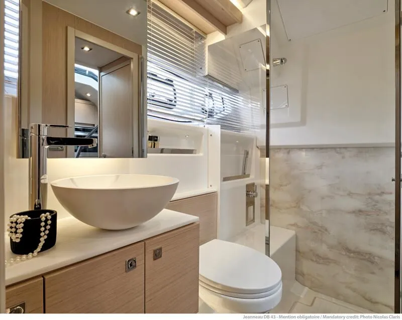 Slide: The Image of Modern bathroom interior of 2025 Jeanneau DB|43 Inboard yacht with sleek fixtures and natural lighting. - 24