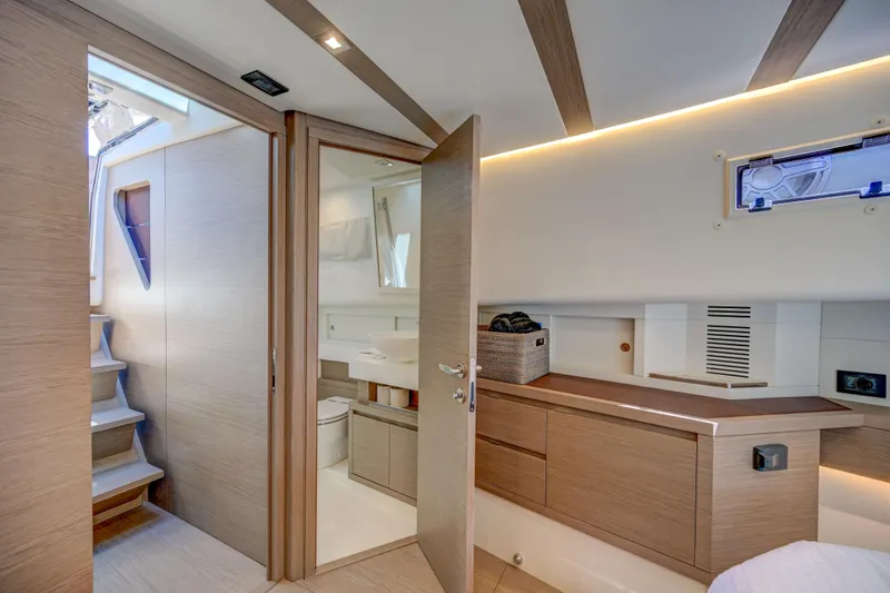Slide: The Image of Modern interior of 2025 Pardo Yachts 50, featuring bathroom and wooden cabinetry. - 11