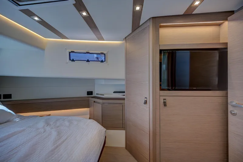 Slide: The Image of Modern interior cabin of 2025 Pardo Yachts 50 with sleek wood finishes. - 12