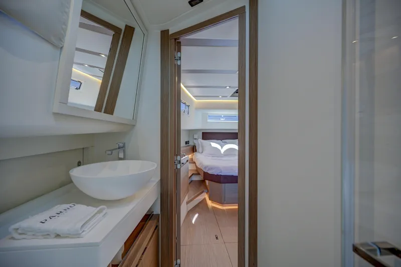 Slide: The Image of Luxurious interior of 2025 Pardo Yachts 50, featuring modern bathroom and cozy bedroom. - 14