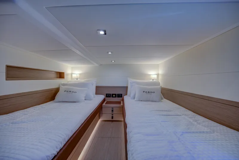 Slide: The Image of 2025 Pardo Yachts 50 interior cabin with twin beds and modern lighting. - 15