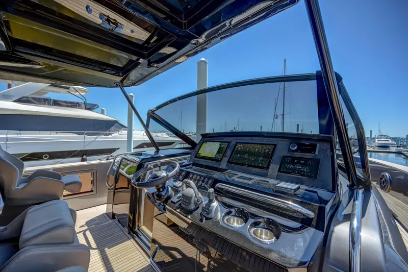 Slide: The Image of Helm station of 2025 Pardo Yachts 50 with advanced navigation systems. - 25