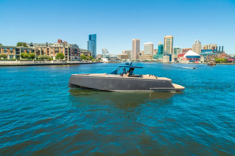 Slide: The Image of Pardo Yachts 50 (2025) cruising in a vibrant city harbor with modern skyline. - 8