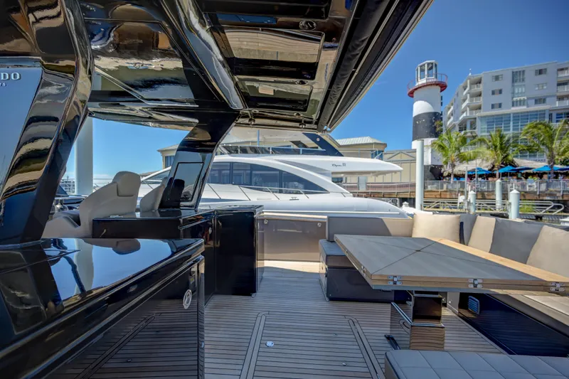 Slide: The Image of Luxury Pardo Yachts 50, 2025 model, docked with modern seating and dining area. - 21