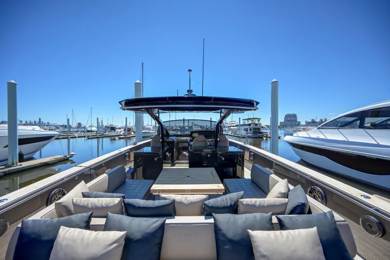 Slide: The Image of 2025 Pardo Yachts 50 luxury yacht docked at marina with plush seating. - 23