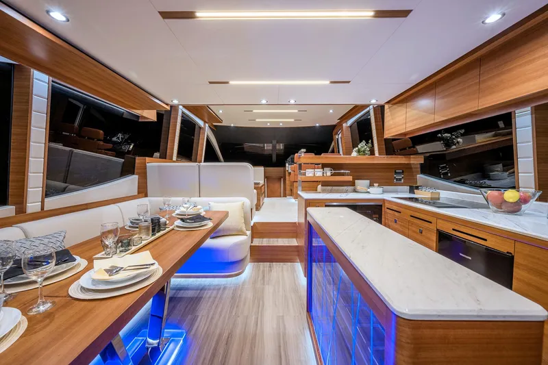 Slide: The Image of Luxurious interior of 2025 Dyna 63 yacht with modern dining and kitchen area. - 12