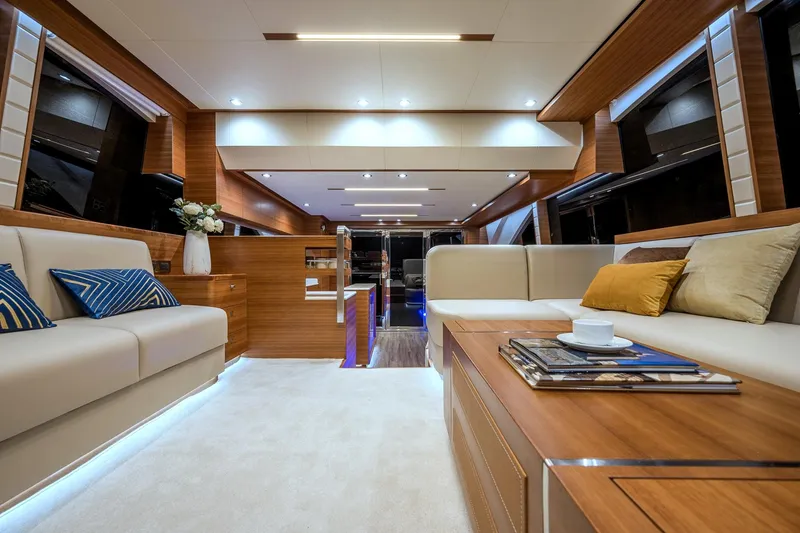 Slide: The Image of Luxurious interior of 2025 Dyna 63 yacht with modern furnishings and ambient lighting. - 13