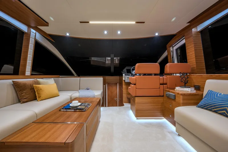 Slide: The Image of Luxurious interior of 2025 Dyna 63 yacht with modern seating and wooden finishes. - 15