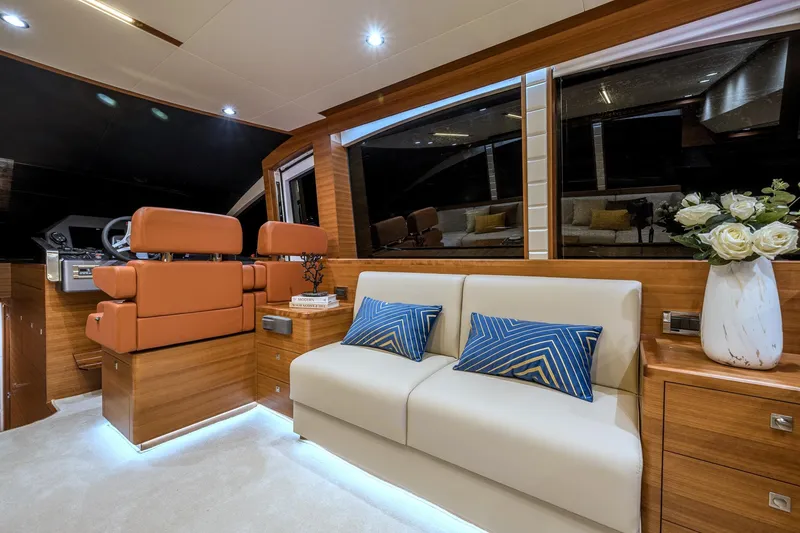 Slide: The Image of Luxurious interior of 2025 Dyna 63 yacht with leather seating and modern decor. - 16
