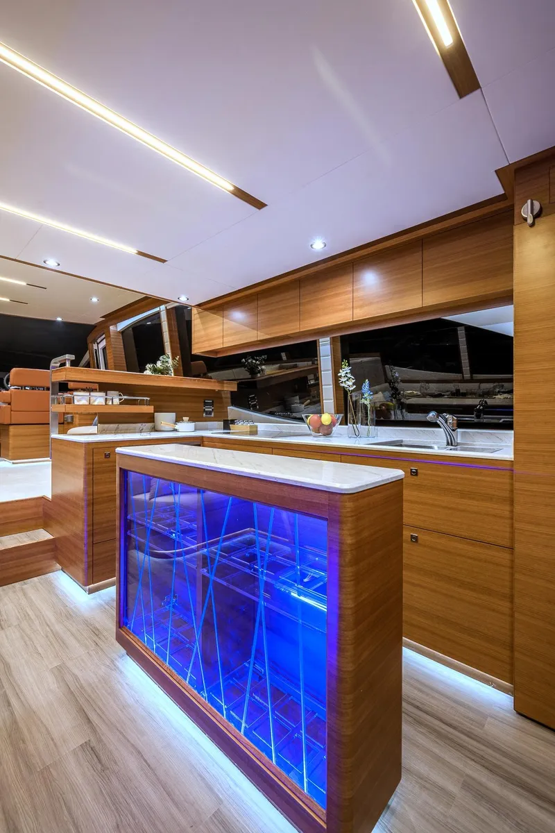 Slide: The Image of Modern kitchen interior of 2025 Dyna 63 yacht with blue LED lighting. - 19