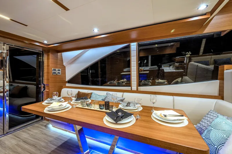 Slide: The Image of Luxurious dining area on the 2025 Dyna 63 yacht with elegant table setting. - 21