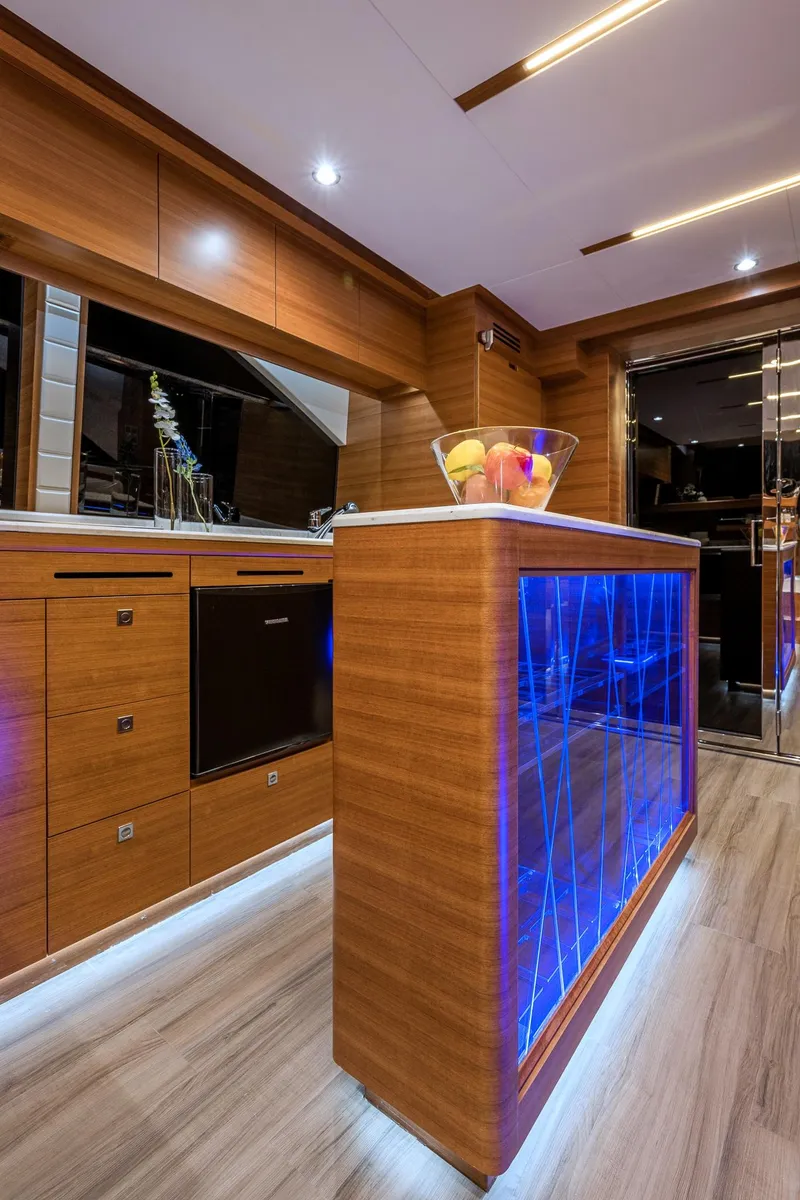 Slide: The Image of Modern kitchen interior of 2025 Dyna 63 yacht with blue LED lighting. - 22