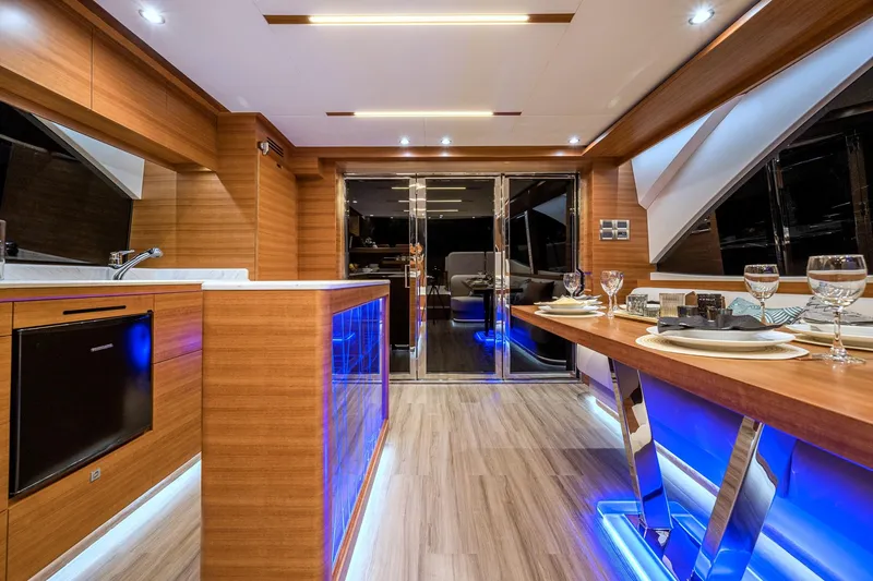 Slide: The Image of Luxurious interior of 2025 Dyna 63 yacht with modern kitchen and dining area. - 25