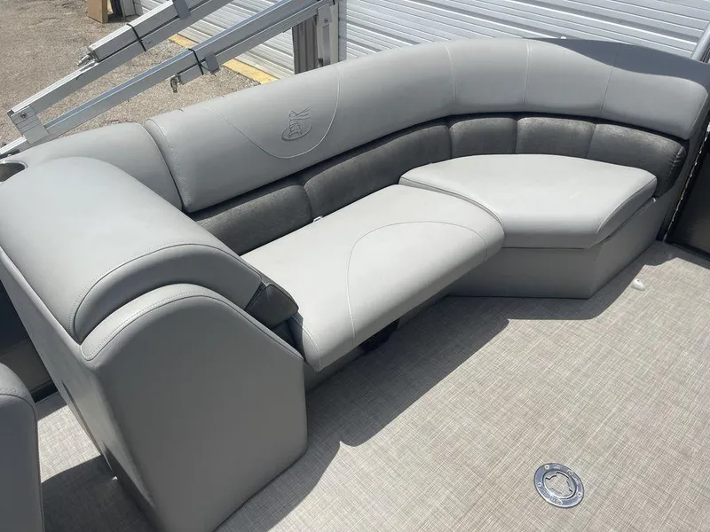 Slide: The Image of 2016 Misty Harbor Biscayne Bay CU 2285 boat interior with gray cushioned seating. - 10