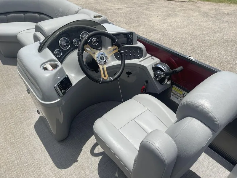 Slide: The Image of 2016 Misty Harbor Boats Biscayne Bay CU 2285 helm with steering wheel and control panel. - 11