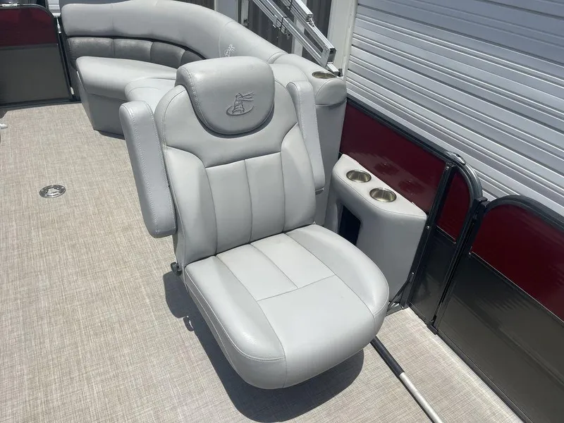 Slide: The Image of 2016 Misty Harbor Biscayne Bay CU 2285 boat interior with gray captain's chair and seating. - 8