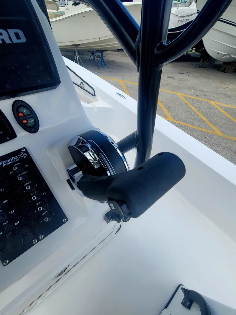 Slide: The Image of Control panel of 2025 Piranha Casador B2200 boat with throttle lever. - 10