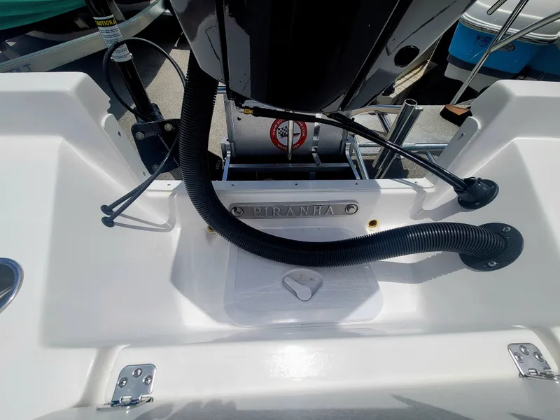 Slide: The Image of Piranha Casador B2200 boat engine compartment, 2025 model, featuring sleek design and modern fittings. - 11