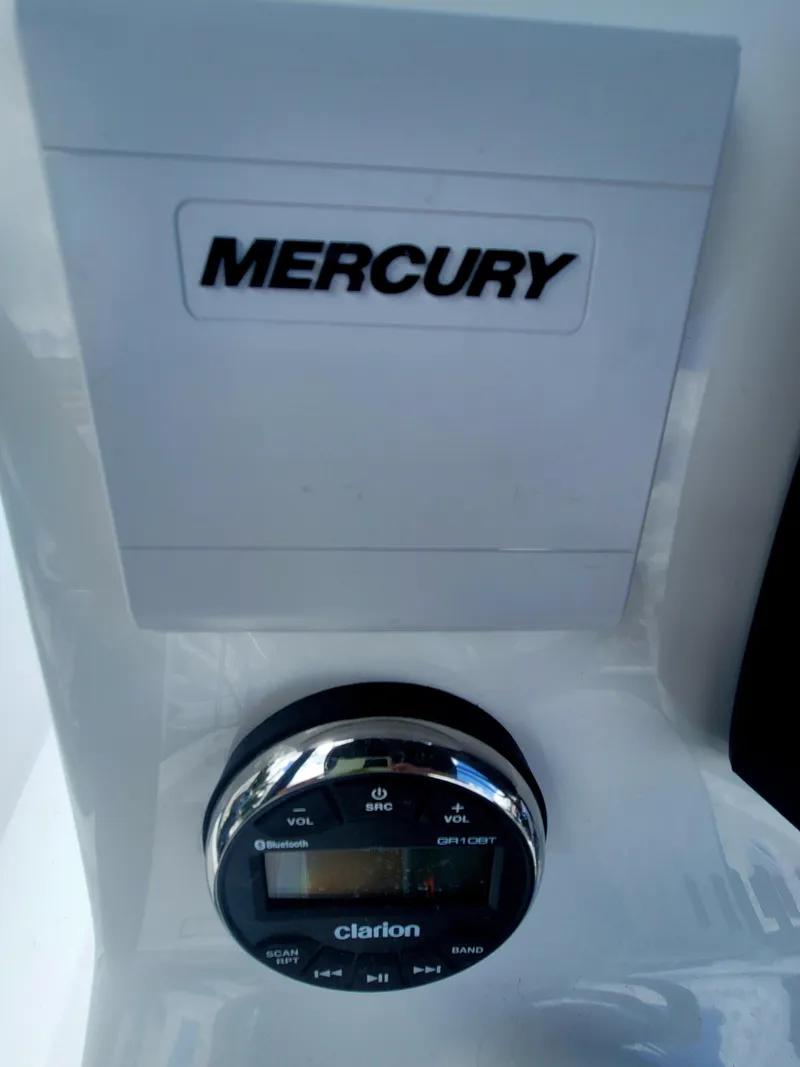 Slide: The Image of Control panel of 2025 Piranha Casador B2200 with Mercury branding and Clarion audio system. - 19