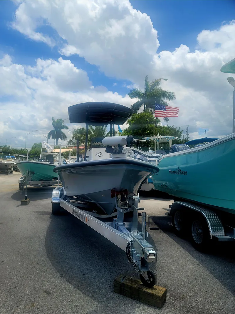 Slide: The Image of 2025 Piranha Casador B2200 boat on trailer, parked outdoors under a partly cloudy sky. - 3