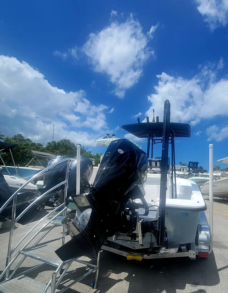 Slide: The Image of 2025 Piranha Casador B2200 boat with outboard motor under a bright blue sky. - 5