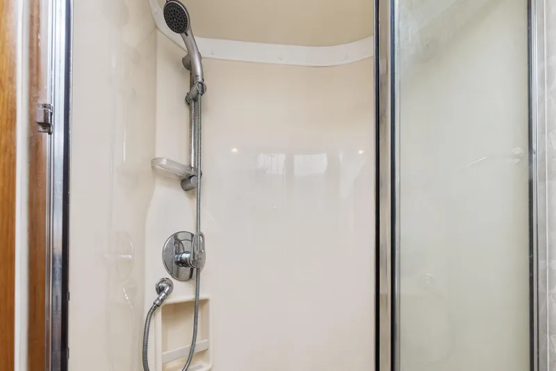 Slide: The Image of 2002 Cabo Convertible Painted shower with handheld showerhead and glass door. - 37