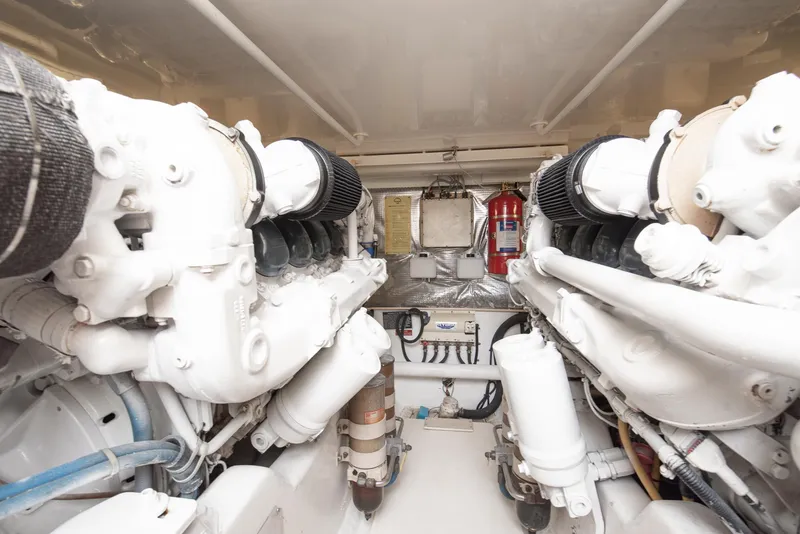Slide: The Image of Engine room of a 2002 Cabo Convertible Painted boat. - 45